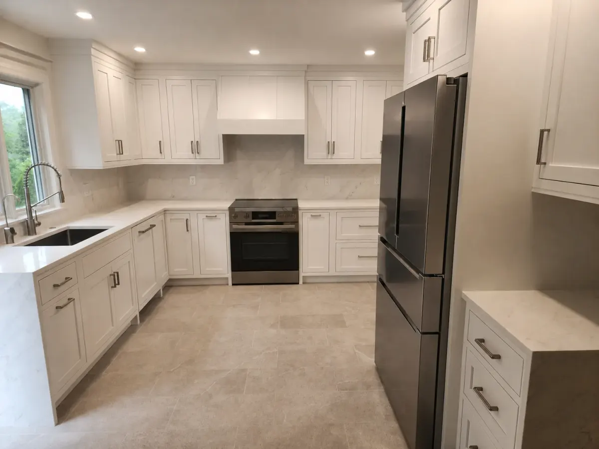 Range wall with custom hood surround and slab backsplash in a Scarsdale, NY kitchen renovation